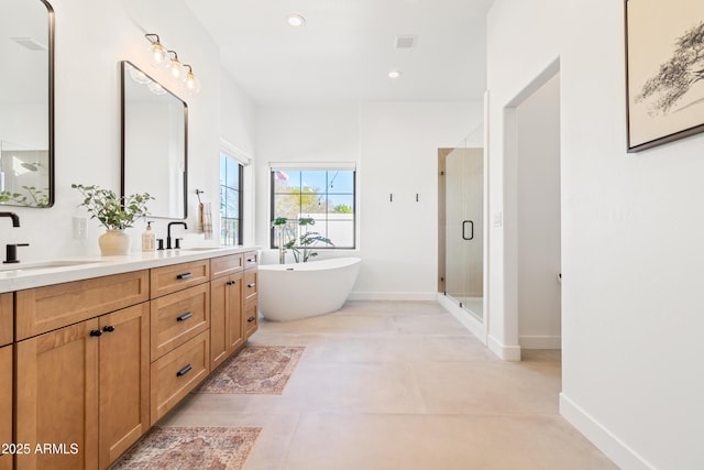 bathroom featuring independent shower and bath, tile patterned flooring, and vanity