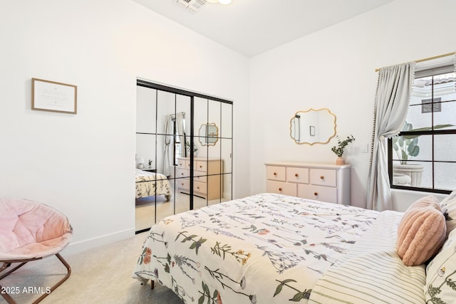 carpeted bedroom with a closet