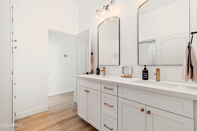 bathroom featuring hardwood / wood-style flooring and vanity