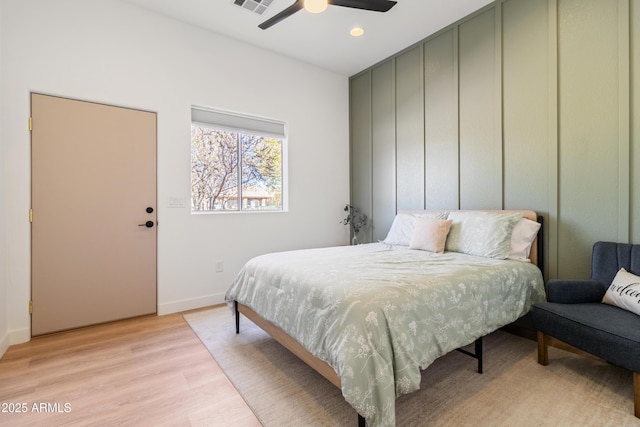 bedroom featuring ceiling fan and light hardwood / wood-style floors