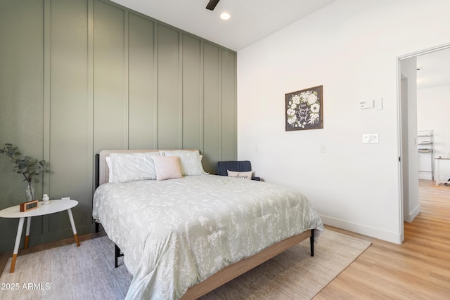 bedroom with light wood-type flooring and ceiling fan