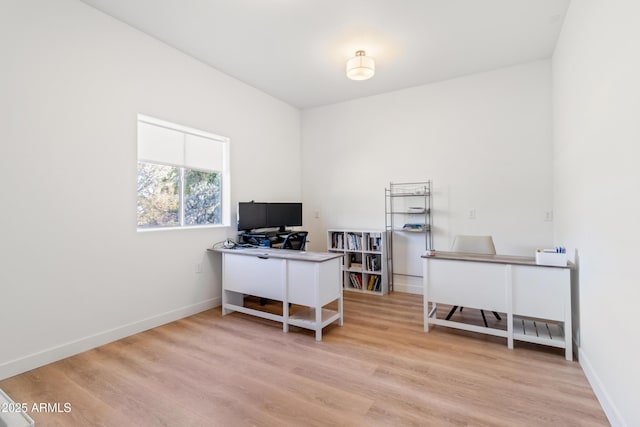 office space with light hardwood / wood-style floors