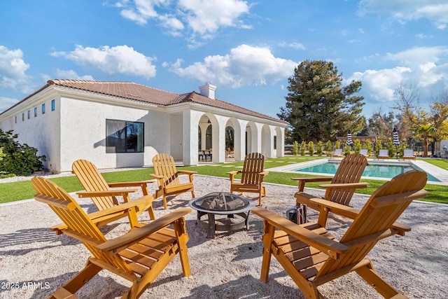 view of patio featuring an outdoor fire pit