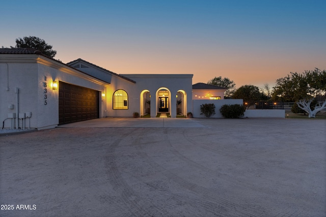 mediterranean / spanish-style home featuring a garage