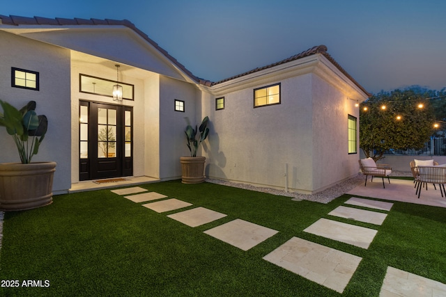 exterior space featuring a patio and a lawn