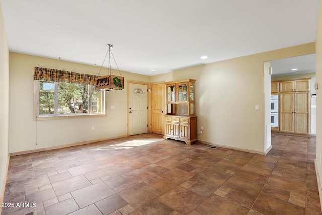 6602 W Dogwood Ln, Pine, AZ 85544 - unfurnished dining area with visible vents, stone finish floor, baseboards, and recessed lighting