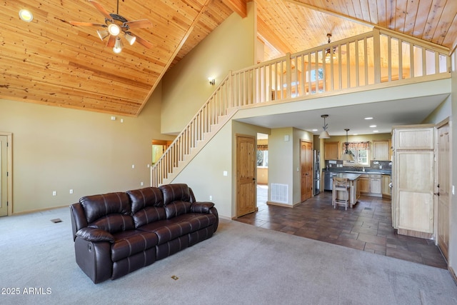 6602 W Dogwood Ln, Pine, AZ 85544 - living room featuring stairs, ceiling fan, wood ceiling, and dark colored carpet