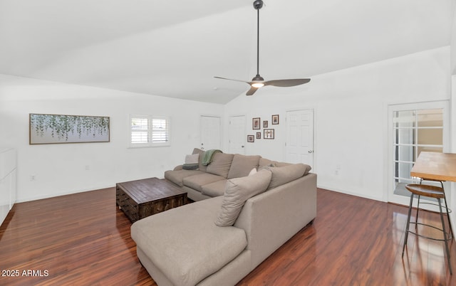 living room with ceiling fan, dark hardwood / wood-style floors, and lofted ceiling