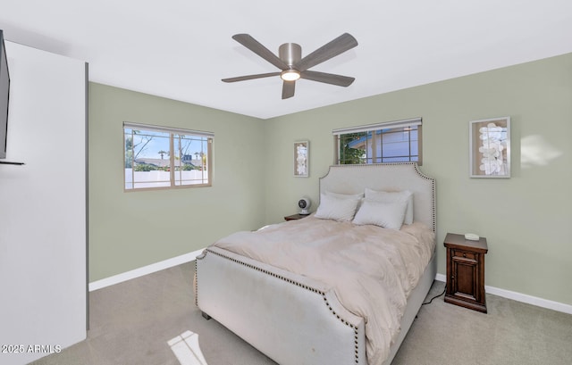 bedroom featuring ceiling fan and light colored carpet