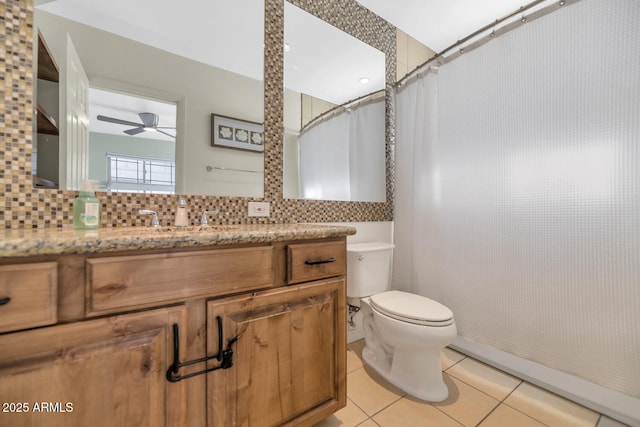 bathroom featuring tile patterned floors, vanity, decorative backsplash, toilet, and ceiling fan