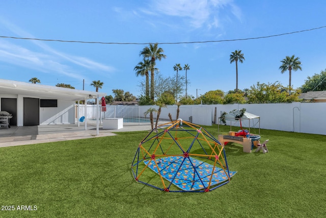 view of yard with a swimming pool and a patio