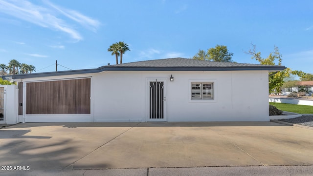 view of side of home with a patio area