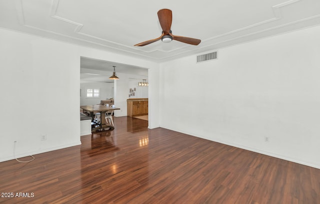 unfurnished living room featuring ceiling fan and dark wood-type flooring