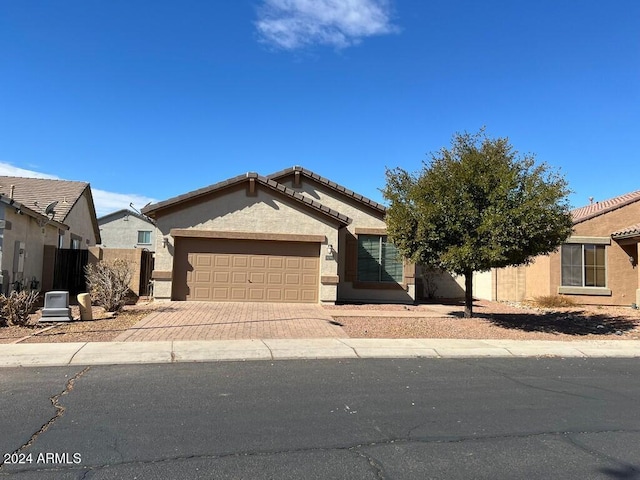 3030 S 102nd Ln, Tolleson, AZ 85353 - ranch-style home featuring an attached garage, decorative driveway, stucco siding, and a tiled roof