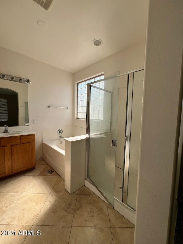 3030 S 102nd Ln, Tolleson, AZ 85353 - bathroom featuring vanity, a bath, a shower stall, and tile patterned floors