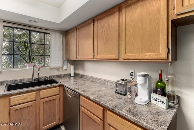 kitchen featuring sink, stainless steel dishwasher, and stone countertops