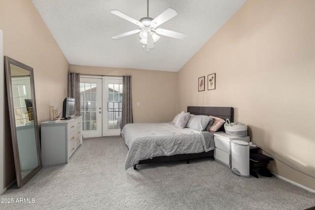 bedroom with access to exterior, a textured ceiling, vaulted ceiling, light colored carpet, and french doors