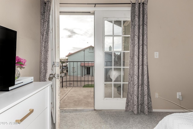 bedroom featuring light colored carpet