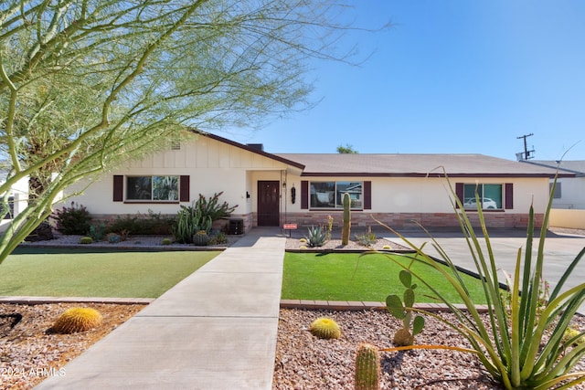 ranch-style house with a front yard