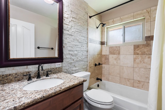 full bathroom featuring shower / tub combo with curtain, vanity, and toilet