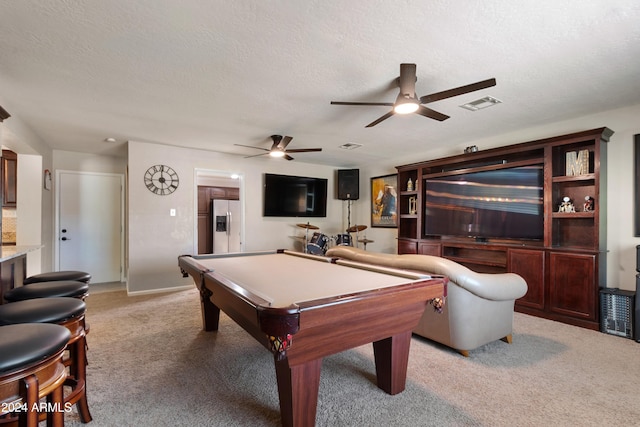 playroom featuring ceiling fan, light colored carpet, a textured ceiling, and pool table