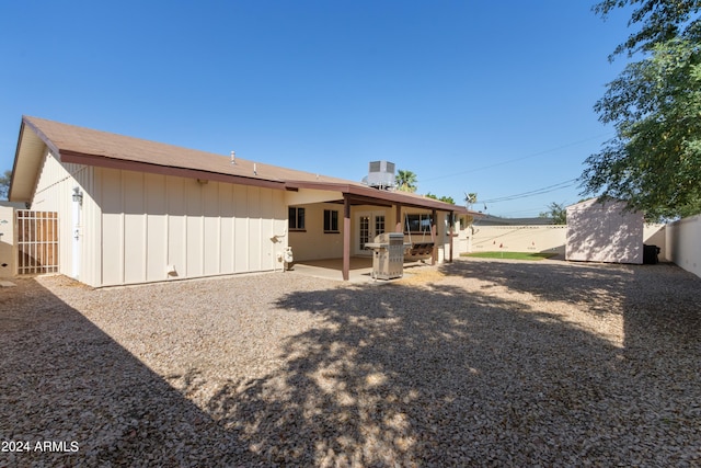 back of property featuring a patio