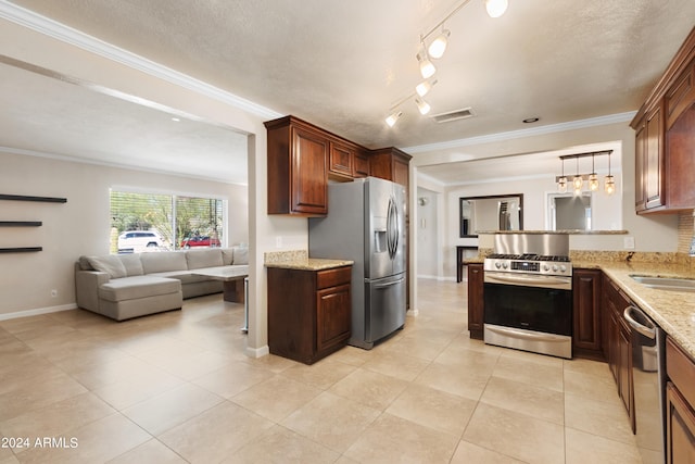 kitchen featuring sink, ornamental molding, a textured ceiling, decorative light fixtures, and stainless steel appliances