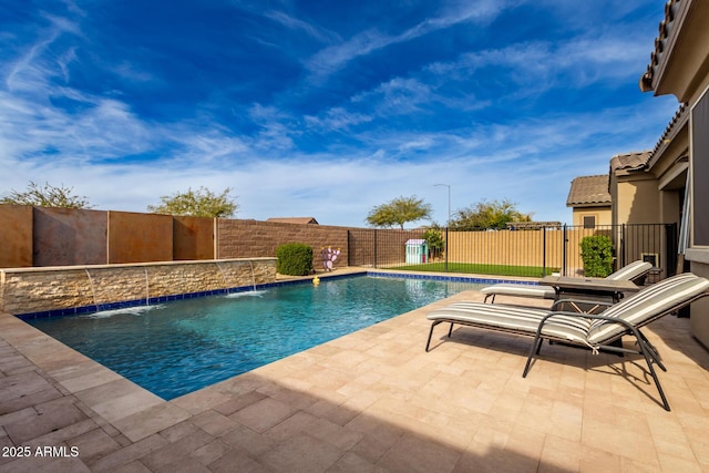 view of swimming pool with a patio and pool water feature