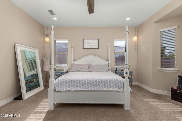 bedroom featuring light carpet and ceiling fan