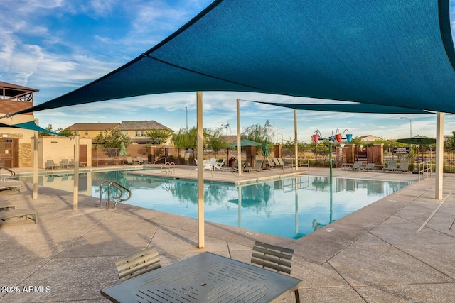 view of swimming pool featuring a patio area