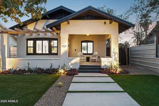 view of front of home with a lawn