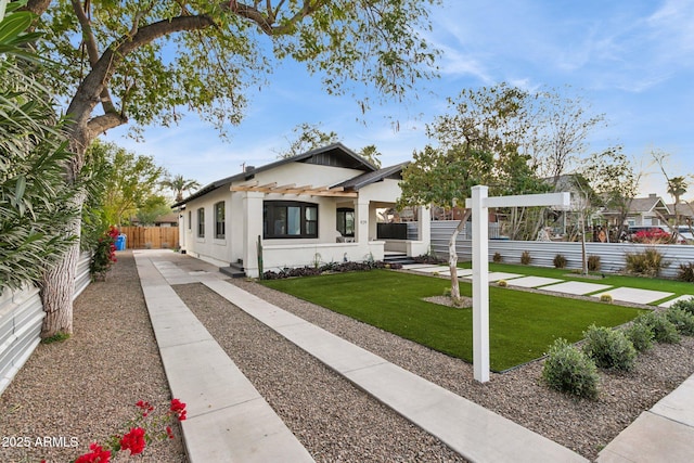 view of front of property featuring a front yard and a pergola