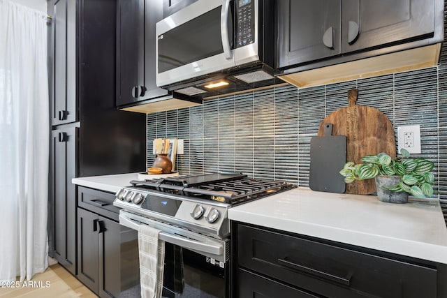 kitchen with backsplash and stainless steel appliances