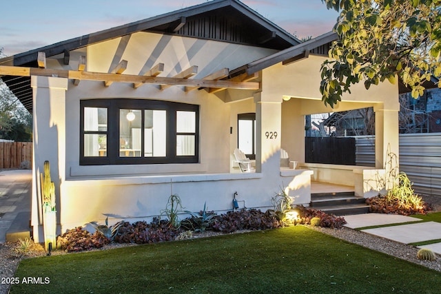 view of front of property with a lawn