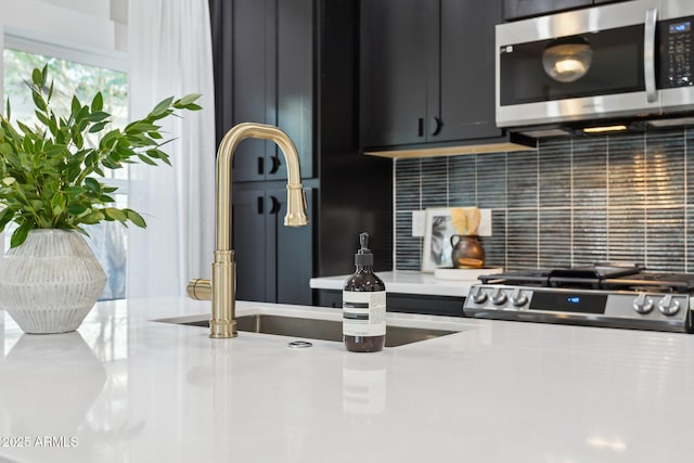 kitchen with backsplash, sink, and range