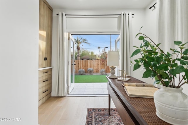 doorway with light hardwood / wood-style floors