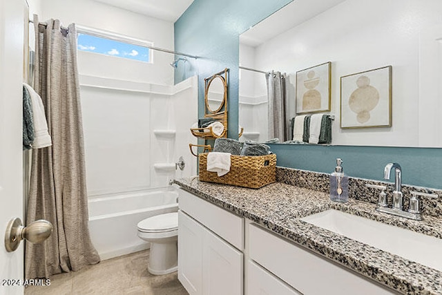 full bathroom with shower / bath combination with curtain, tile patterned floors, vanity, and toilet