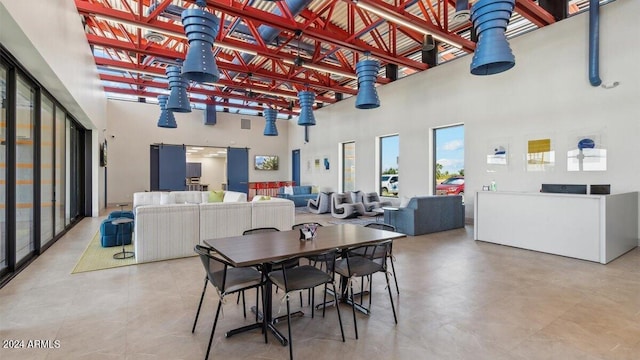 dining space with a high ceiling