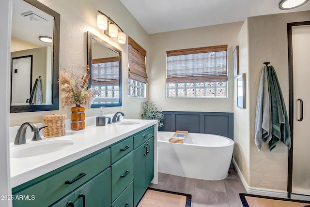 17493 W Arroyo Way, Goodyear, AZ 85338 - full bath with healthy amount of natural light, double vanity, and a freestanding tub