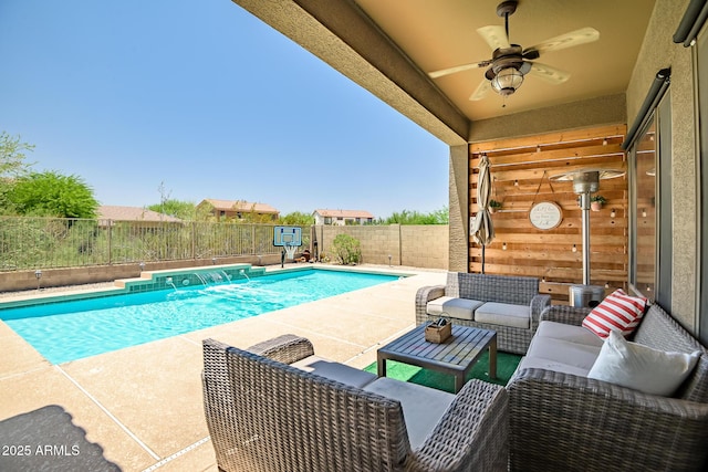 17493 W Arroyo Way, Goodyear, AZ 85338 - view of swimming pool featuring ceiling fan, an outdoor living space, a fenced backyard, and a patio