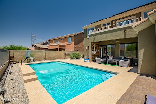 17493 W Arroyo Way, Goodyear, AZ 85338 - view of swimming pool with an outdoor hangout area, a fenced backyard, a ceiling fan, and a patio