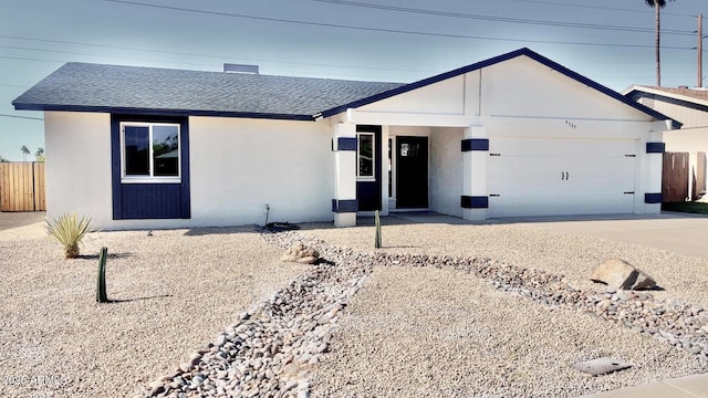 4509 E La Puente Ave, Phoenix, AZ 85044 - ranch-style home with roof with shingles, an attached garage, fence, and concrete driveway