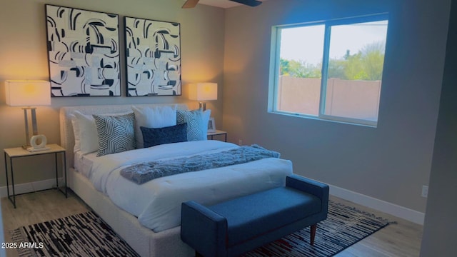 4509 E La Puente Ave, Phoenix, AZ 85044 - bedroom with wood finished floors, baseboards, and a ceiling fan