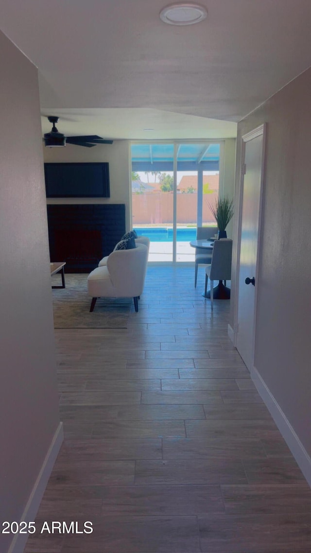 4509 E La Puente Ave, Phoenix, AZ 85044 - hallway with baseboards and wood finished floors