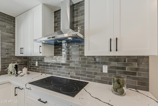 4509 E La Puente Ave, Phoenix, AZ 85044 - kitchen featuring wall chimney exhaust hood, black electric stovetop, white cabinetry, and light stone counters