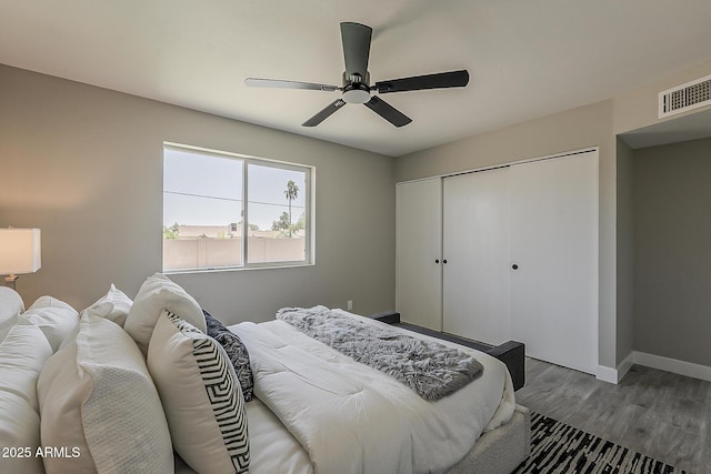 4509 E La Puente Ave, Phoenix, AZ 85044 - bedroom with a closet, wood finished floors, baseboards, and ceiling fan
