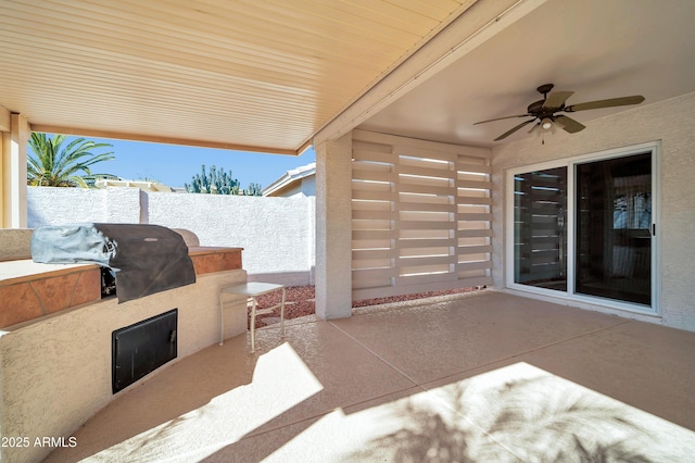 view of patio featuring ceiling fan