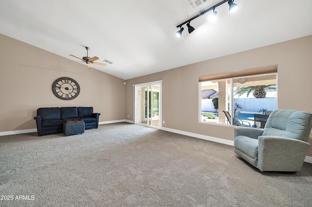 sitting room with vaulted ceiling, carpet, ceiling fan, and rail lighting