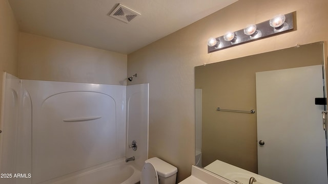 bathroom with shower / bath combination, visible vents, vanity, and toilet