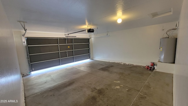 garage with water heater and a garage door opener